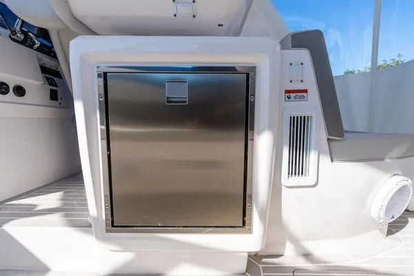 Slide: The Image of 2023 Intrepid 438 Evolution yacht interior with stainless steel appliance. - 22