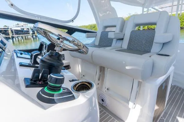 Slide: The Image of 2023 Intrepid 438 Evolution boat interior with modern helm and seating. - 27