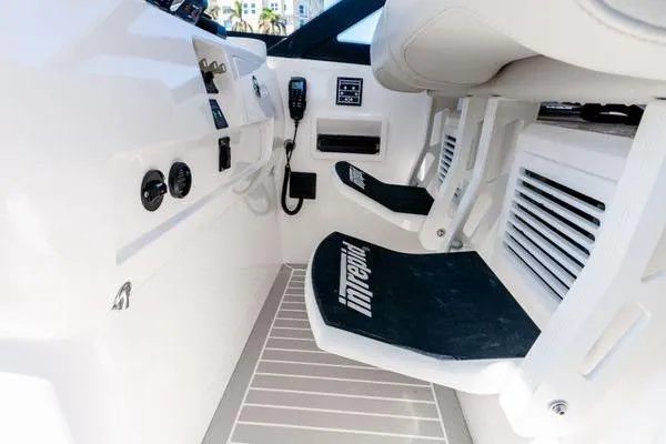 Slide: The Image of 2023 Intrepid 438 Evolution cockpit with modern controls and seating. - 28