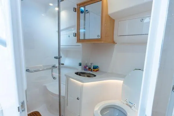 Slide: The Image of Luxurious bathroom in 2023 Intrepid 438 Evolution yacht with modern fixtures and sleek design. - 31