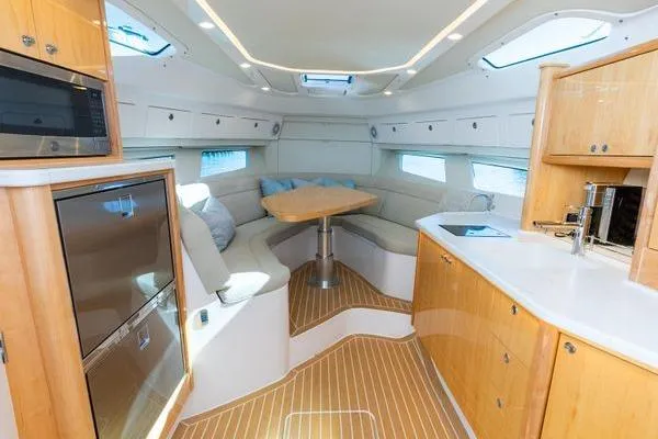 Slide: The Image of Luxurious interior of 2023 Intrepid 438 Evolution yacht with modern kitchen and seating area. - 33