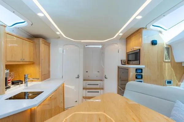 Slide: The Image of Luxurious interior of 2023 Intrepid 438 Evolution yacht with modern kitchen amenities. - 39