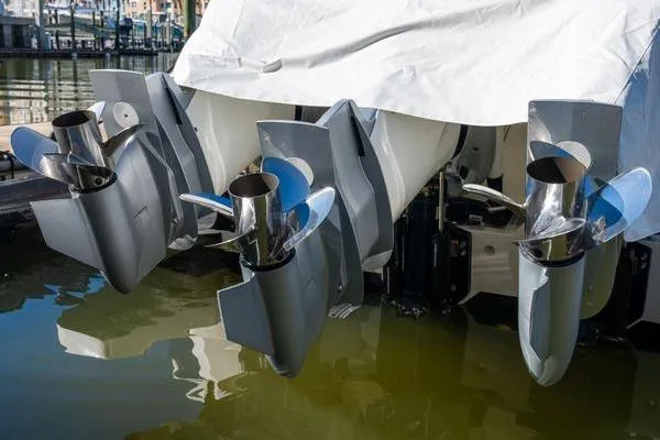 Slide: The Image of 2023 Intrepid 438 Evolution boat engines under cover at marina. - 4