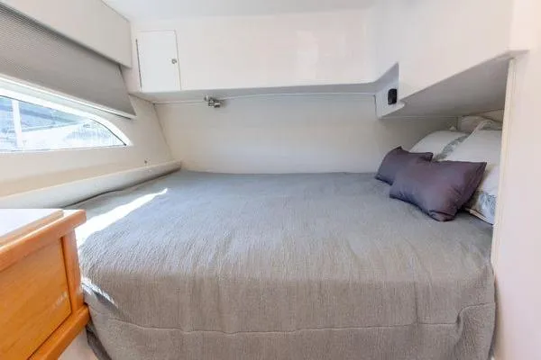 Slide: The Image of 2023 Intrepid 438 Evolution cabin with cozy bed and modern design. - 42