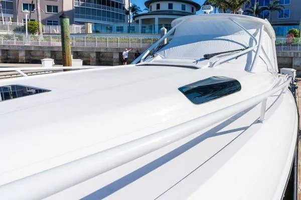 Slide: The Image of 2023 Intrepid 438 Evolution yacht docked at a marina, showcasing sleek design. - 8