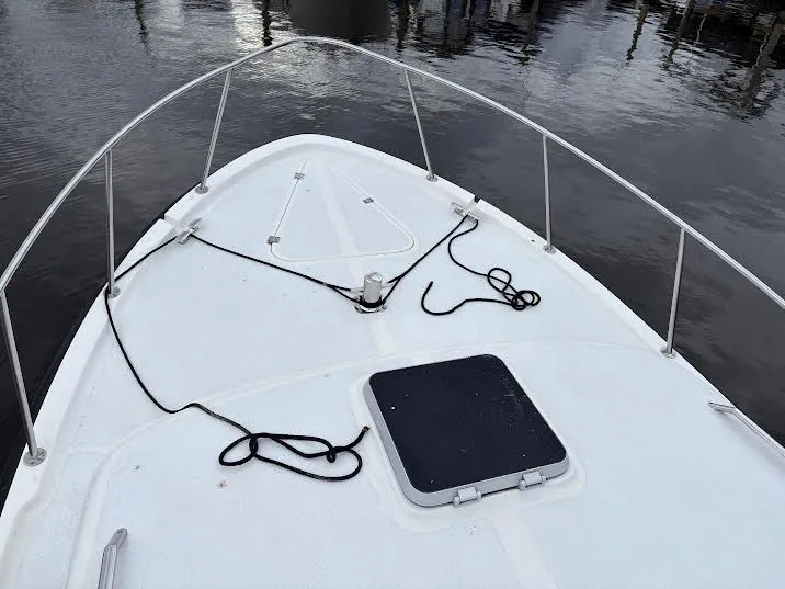 Slide: The Image of Bow deck of a 1986 Luhrs Alura on calm water. - 3