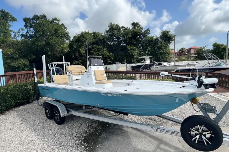 The Image of 2022 Sportsman Tournament 214 Bay Boat on trailer, parked outdoors. - 1