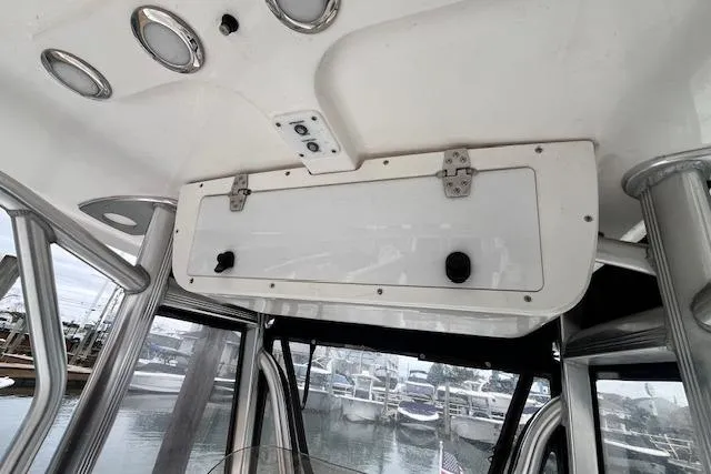 Slide: The Image of Interior view of a 2018 Sea Hunt Ultra 211 boat with storage compartment. - 14