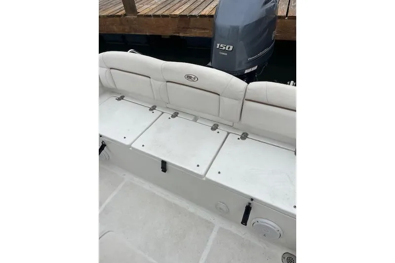 Slide: The Image of 2018 Sea Hunt Ultra 211 boat with Yamaha 150 engine, docked. - 3