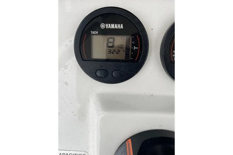 Slide: The Image of Yamaha tachometer on 2018 Sea Hunt Ultra 211 boat dashboard, displaying RPM and engine hours. - 5