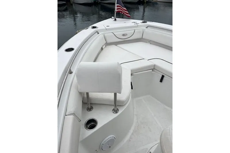 Slide: The Image of 2018 Sea Hunt Ultra 211 boat interior with seating and American flag. - 9