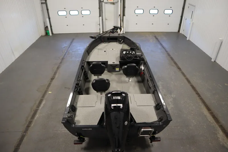 Slide: The Image of 2024 Crestliner 1750 Hawk boat in a garage, featuring a 115 horsepower engine. - 10