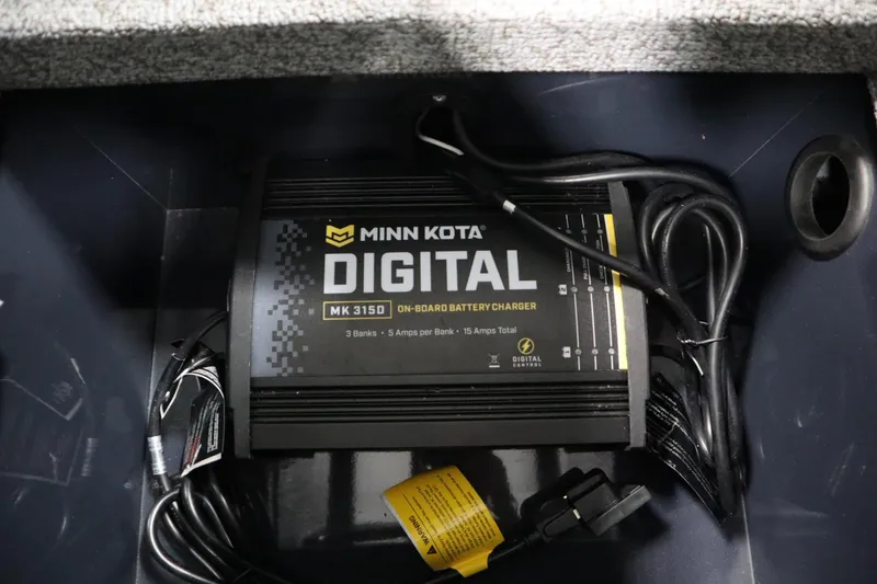 Slide: The Image of Minn Kota digital battery charger in 2024 Crestliner 1750 Hawk boat. - 21