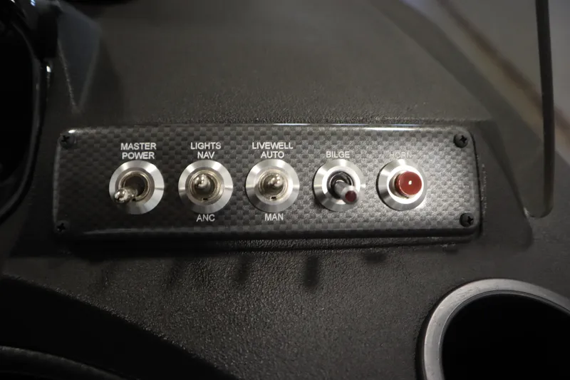Slide: The Image of Control panel of 2024 Crestliner 1750 Hawk boat with switches for power, lights, and horn. - 27