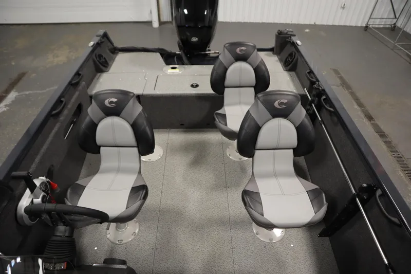 Slide: The Image of 2024 Crestliner 1750 Hawk boat interior with four gray and black seats. - 34