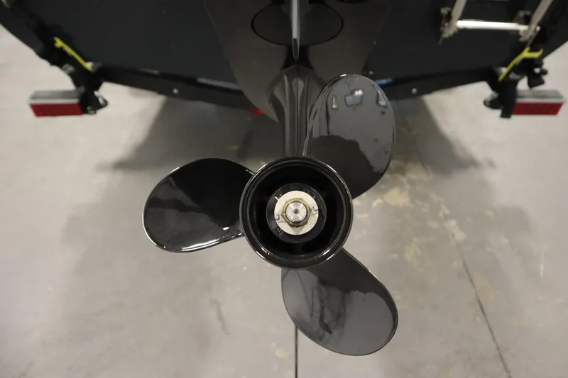 Slide: The Image of 2024 Crestliner 1750 Hawk boat propeller, close-up view in a garage setting. - 42