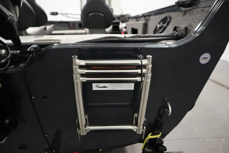 Slide: The Image of 2024 Crestliner 1750 Hawk boat interior with folded stainless steel ladder. - 43