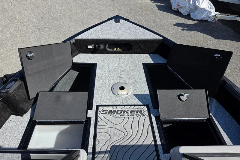 Slide: The Image of 2026 Smoker Craft Adventurer 188 DC boat interior with open storage compartments. - 15