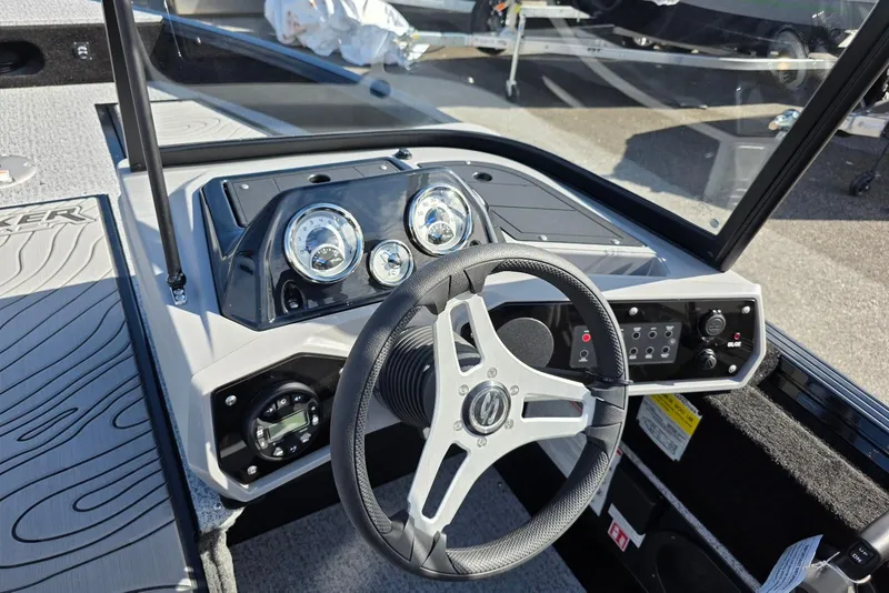 Slide: The Image of 2026 Smoker Craft Adventurer 188 DC boat dashboard with steering wheel and gauges. - 20