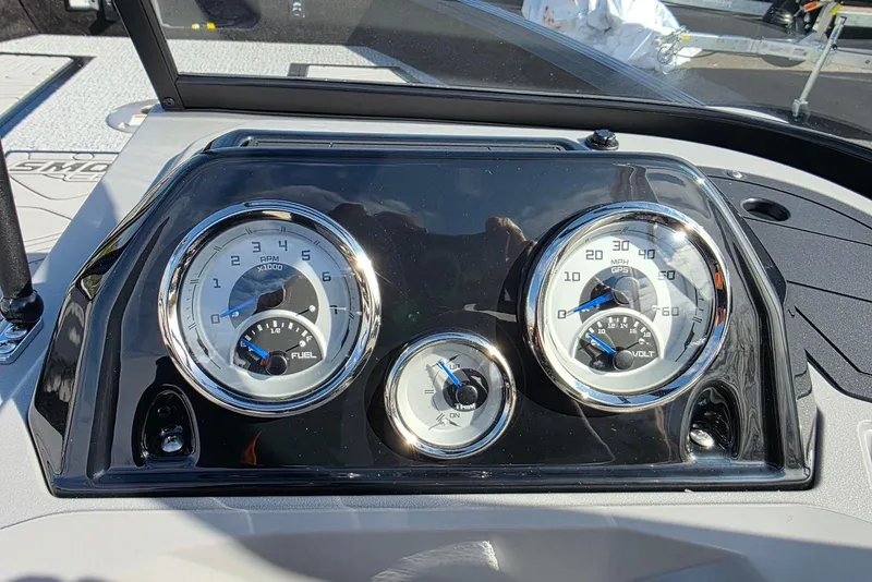 Slide: The Image of Dashboard of 2026 Smoker Craft Adventurer 188 DC boat with gauges and controls. - 21