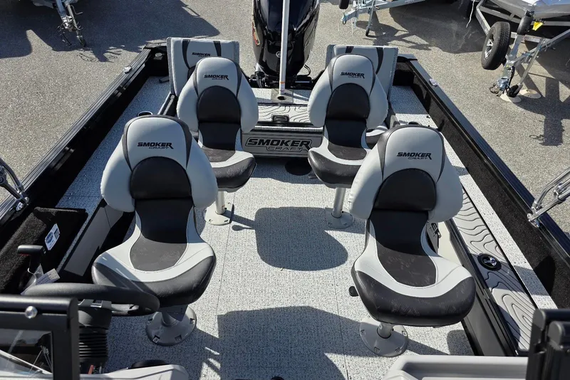 Slide: The Image of 2026 Smoker Craft Adventurer 188 DC boat interior with four cushioned seats. - 23