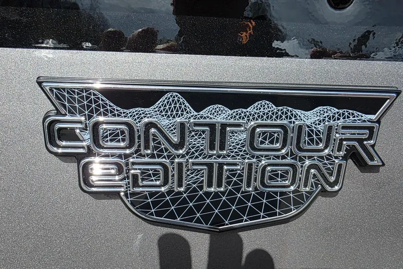 Slide: The Image of Contour Edition badge on 2026 Smoker Craft Adventurer 188 DC boat. - 3
