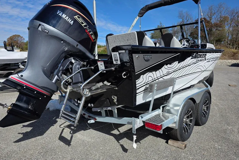 Slide: The Image of 2026 Smoker Craft Adventurer 188 DC boat with Yamaha engine on trailer. - 4