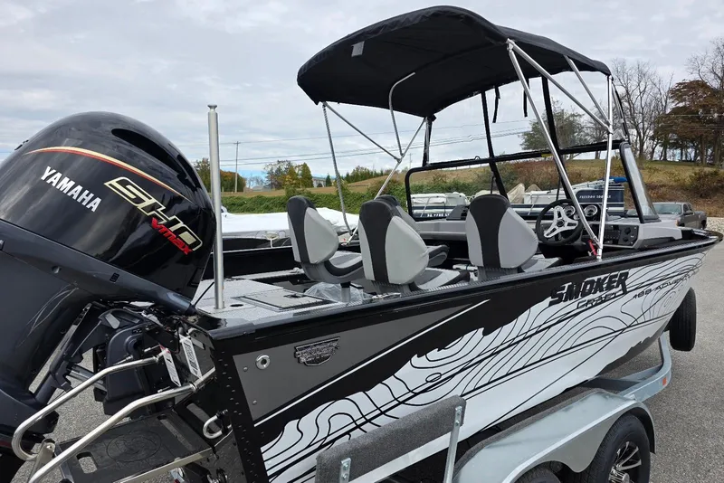 Slide: The Image of 2026 Smoker Craft Adventurer 188 DC boat with Yamaha engine, parked on trailer. - 7