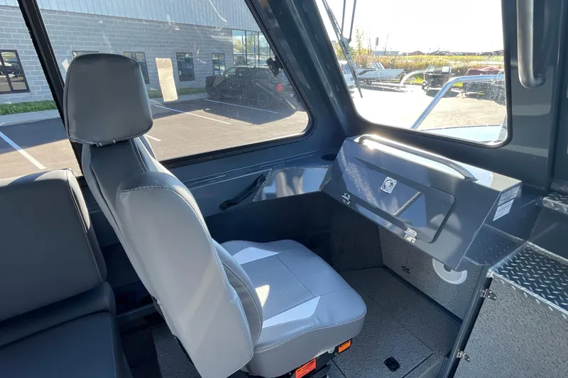Slide: The Image of Interior of 2026 Hewescraft 250 Alaskan ET HT boat, featuring seating and storage. - 21