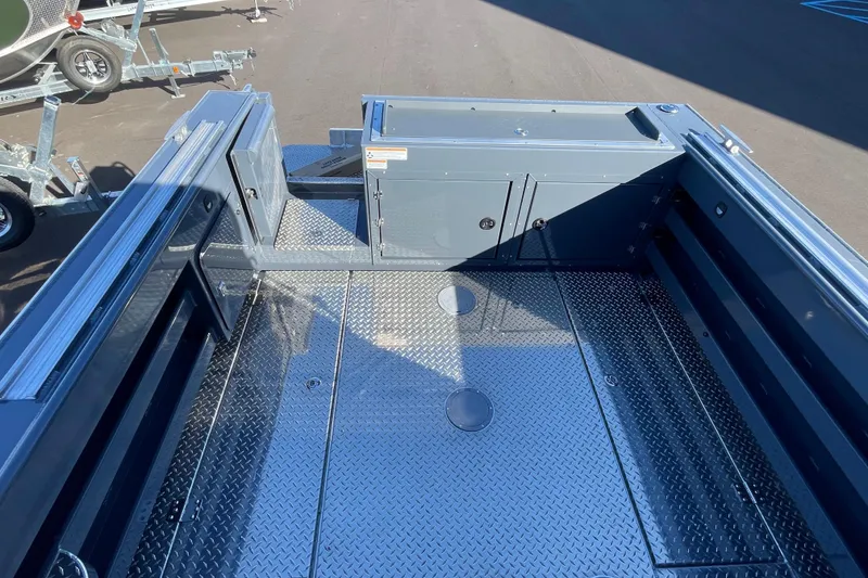 Slide: The Image of 2026 Hewescraft 250 Alaskan ET HT boat deck with diamond plate flooring. - 3