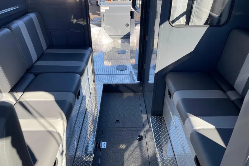 Slide: The Image of Interior of 2026 Hewescraft 250 Alaskan ET HT boat with gray seating and diamond plate flooring. - 30