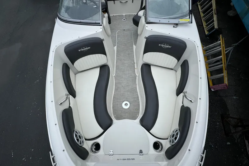 Slide: The Image of 2017 Stingray 204 LR boat interior with sleek seating and modern design. - 7