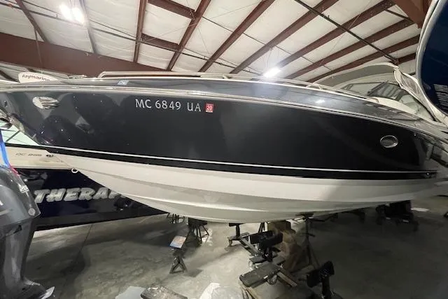 The Image of 2017 Formula 350 Crossover Bowrider in storage, black hull, indoor facility. - 0