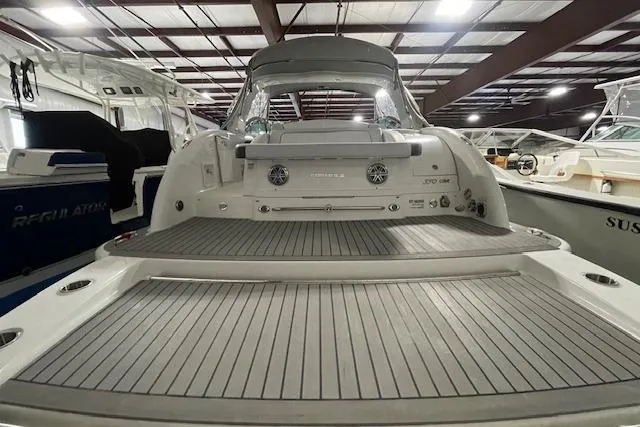 Slide: The Image of 2017 Formula 350 Crossover Bowrider, rear view in a showroom setting. - 10