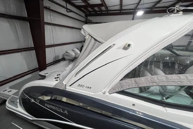 Slide: The Image of 2017 Formula 350 Crossover Bowrider in storage, showcasing sleek design and luxury features. - 12