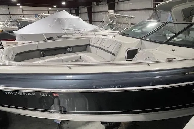 Slide: The Image of 2017 Formula 350 Crossover Bowrider in storage, showcasing sleek design and spacious seating. - 16