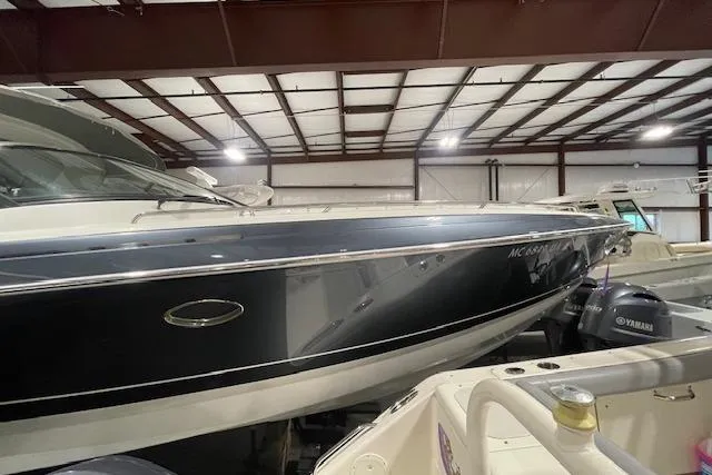 Slide: The Image of 2017 Formula 350 Crossover Bowrider in storage, showcasing sleek design and Yamaha engines. - 18