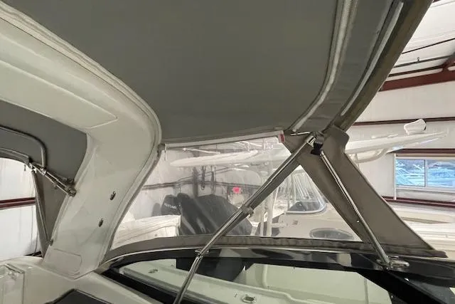 Slide: The Image of 2017 Formula 350 Crossover Bowrider interior with canopy and sleek design. - 24