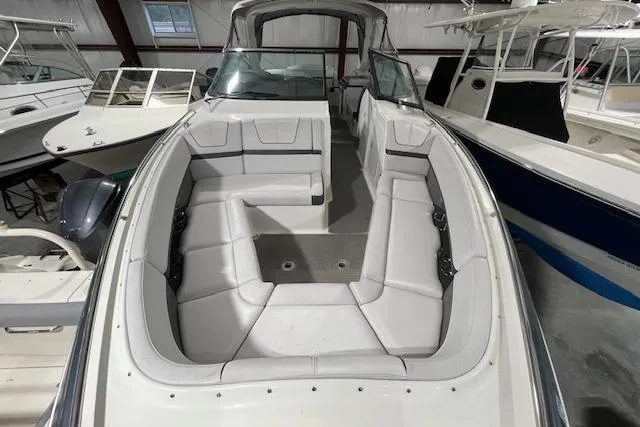 Slide: The Image of 2017 Formula 350 Crossover Bowrider with spacious seating in a showroom. - 25