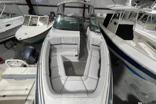 Slide: The Image of 2017 Formula 350 Crossover Bowrider in storage, showcasing spacious seating and sleek design. - 26