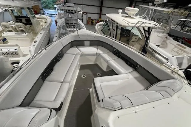 Slide: The Image of 2017 Formula 350 Crossover Bowrider with spacious seating in a showroom. - 27