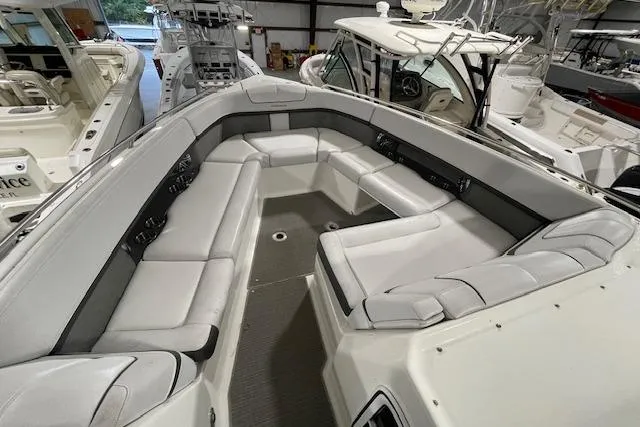 Slide: The Image of 2017 Formula 350 Crossover Bowrider with spacious seating in a showroom. - 30