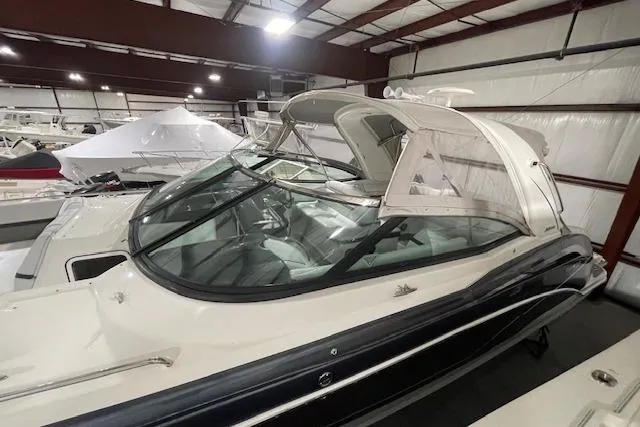 Slide: The Image of 2017 Formula 350 Crossover Bowrider in indoor storage, showcasing sleek design and spacious interior. - 4