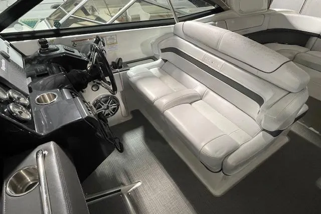 Slide: The Image of 2017 Formula 350 Crossover Bowrider interior with white seating and sleek dashboard. - 40