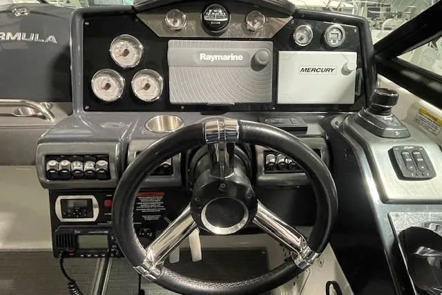 Slide: The Image of 2017 Formula 350 Crossover Bowrider dashboard with steering wheel and navigation controls. - 45