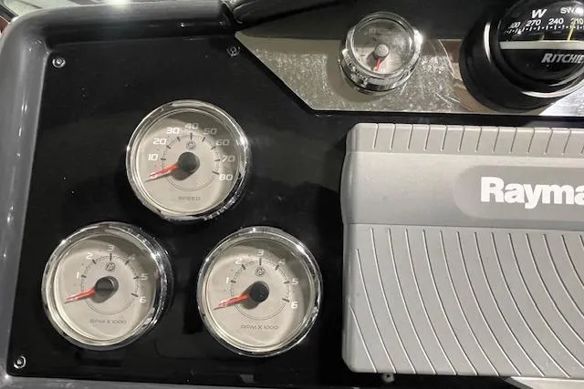 Slide: The Image of Dashboard of a 2017 Formula 350 Crossover Bowrider with gauges and Raymarine equipment. - 47