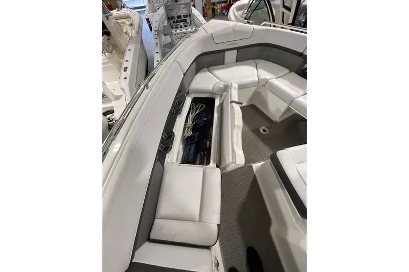 Slide: The Image of 2017 Formula 350 Crossover Bowrider interior with open storage compartment. - 54