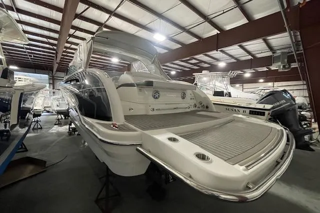 Slide: The Image of 2017 Formula 350 Crossover Bowrider in a showroom, showcasing sleek design and spacious deck. - 6