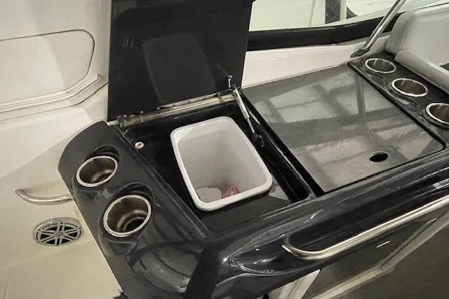 Slide: The Image of 2017 Formula 350 Crossover Bowrider interior with cup holders and storage compartment. - 61