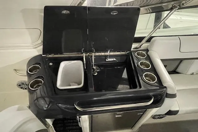 Slide: The Image of 2017 Formula 350 Crossover Bowrider wet bar with sink and cup holders. - 62
